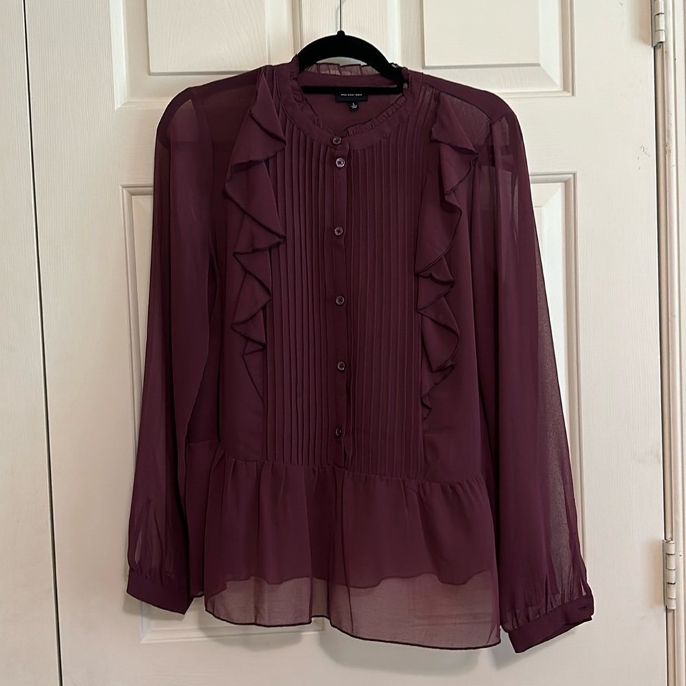 Gently used blouse color is burgundy large size.